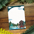 kraken notepads on a dark wood background