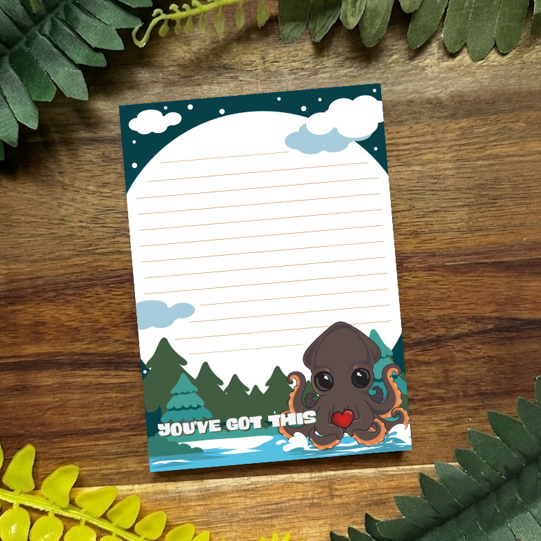 kraken notepads on a dark wood background