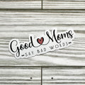 Sticker with 'Good moms say bad words' text on a wooden surface