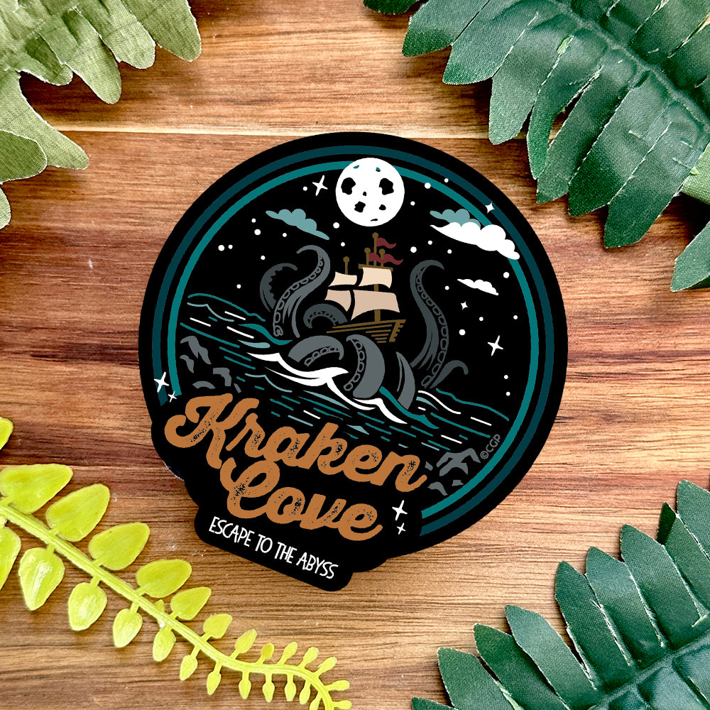 Kraken Cove sticker on dark wooden background
