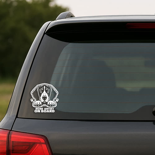 Car window with a dog-themed 'Nose Artist on Board' decal.