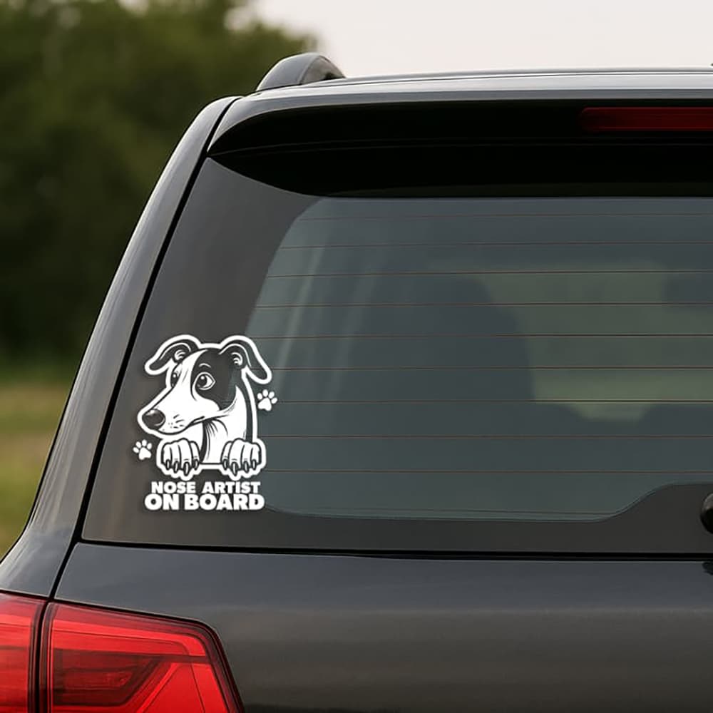Car window with a dog-themed 'Nose Artist on Board' decal.