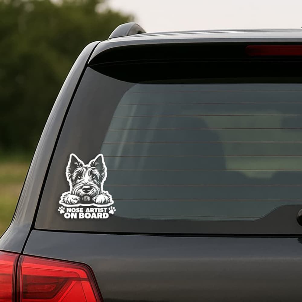 Car window with a dog-themed 'Nose Artist on Board' decal.
