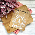Vinyl decal of a dog with 'Nose Artist on Board' text on wooden boards with pink flowers in the background.