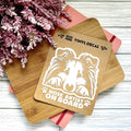 Vinyl decal with a dog illustration and text on a wooden surface with pink flowers.