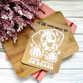 Vinyl decal with a dog illustration and text on a wooden surface with pink flowers.