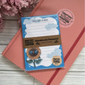 Handmade notepad with sunflower design on a pink surface