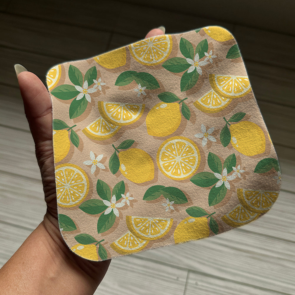 Lemon cleaning cloth in a hand