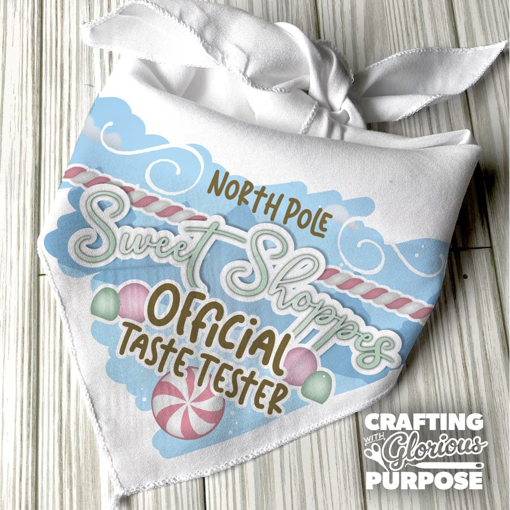 White bandana with festive design and text on a wooden surface