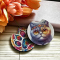 Colorful cat-themed coasters with floral background