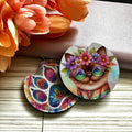 Colorful cat-themed coasters with floral background