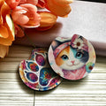 Colorful cat-themed coasters with floral background