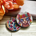 Colorful cat-themed coasters with floral background