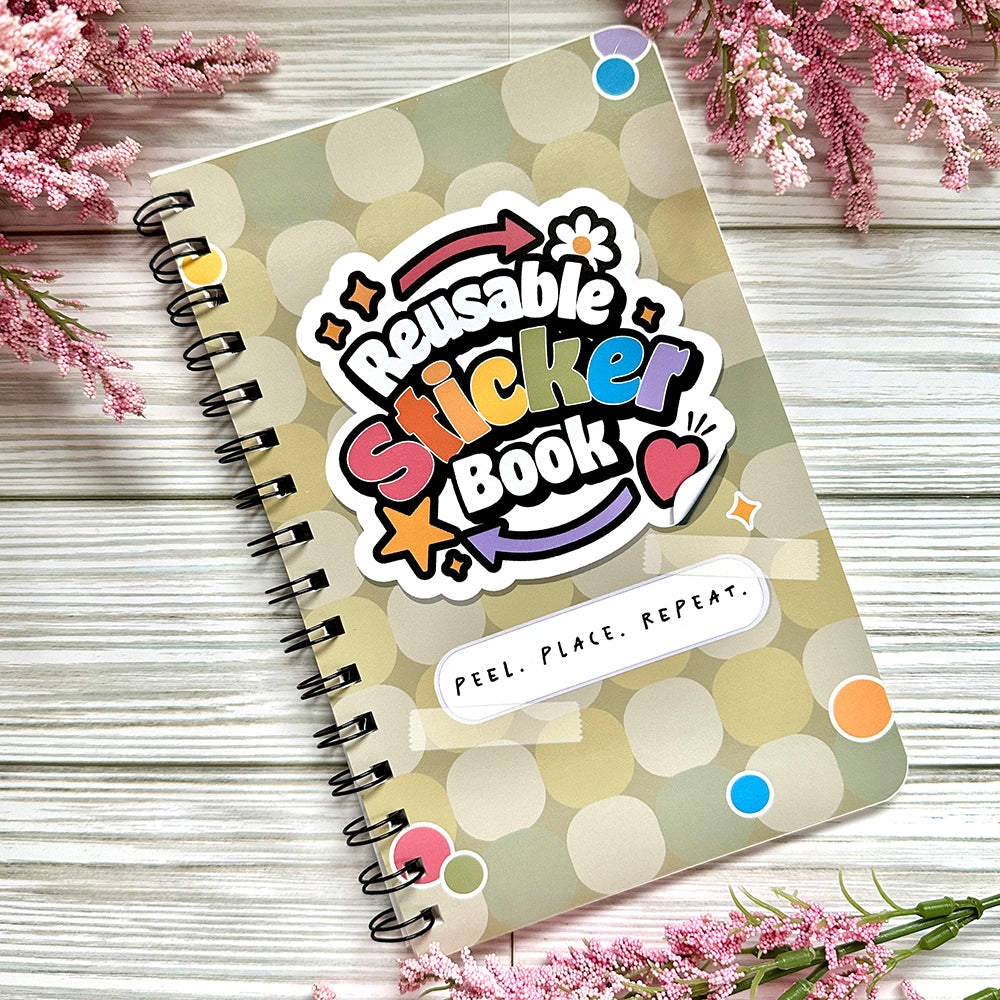 Reusable sticker book on wooden surface