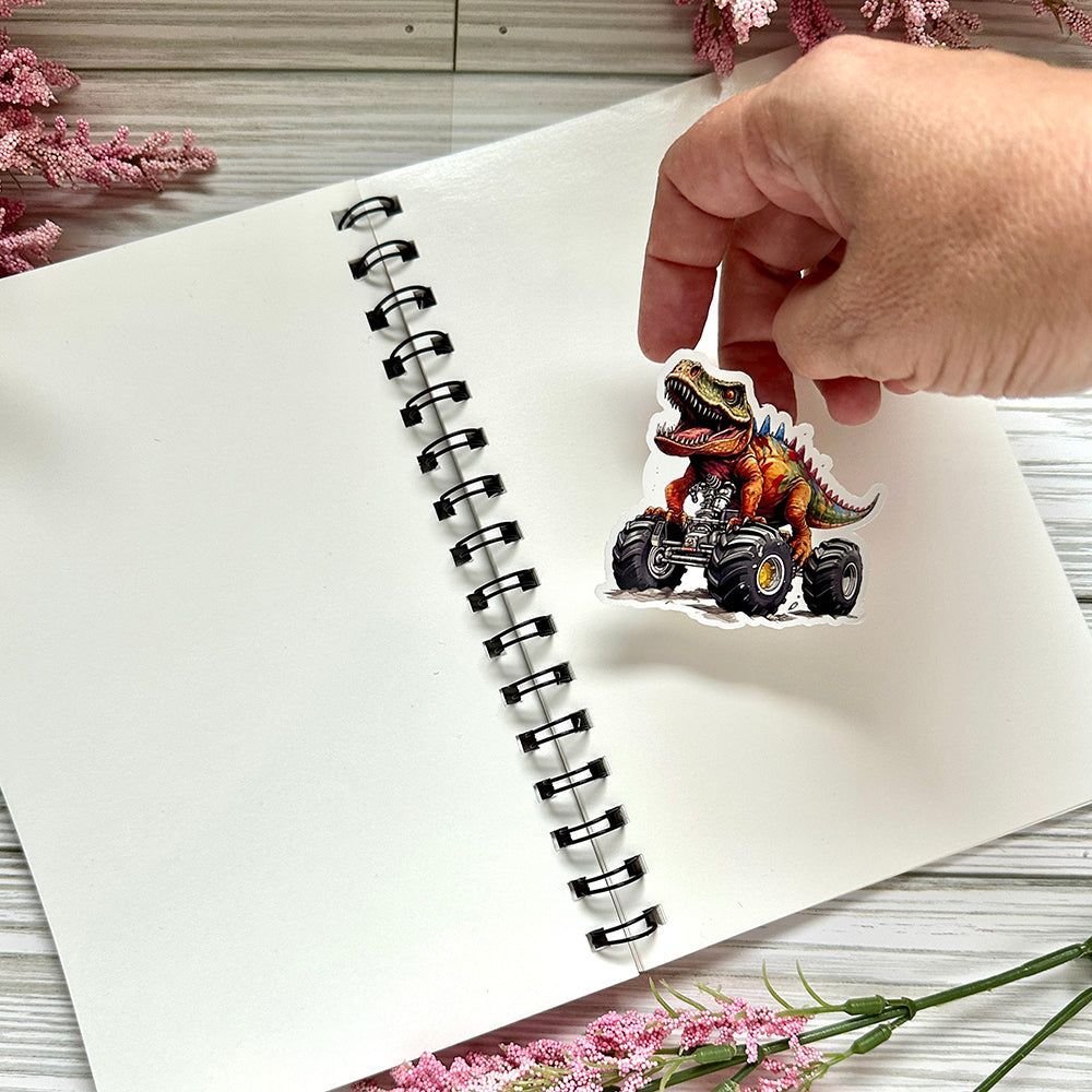 Reusable sticker book with sticker being added to the book on wooden surface.