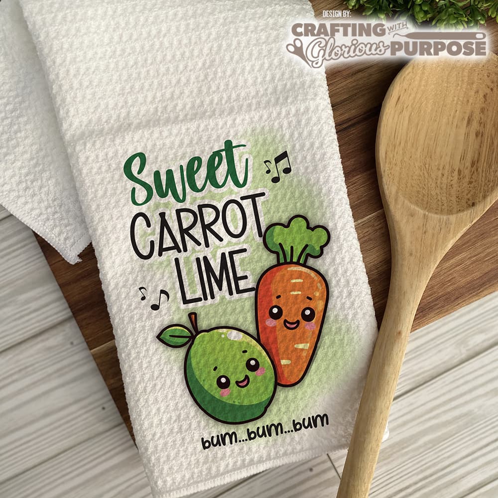 Kitchen towel with cartoon carrot and lime design and wooden spoon on a wooden surface