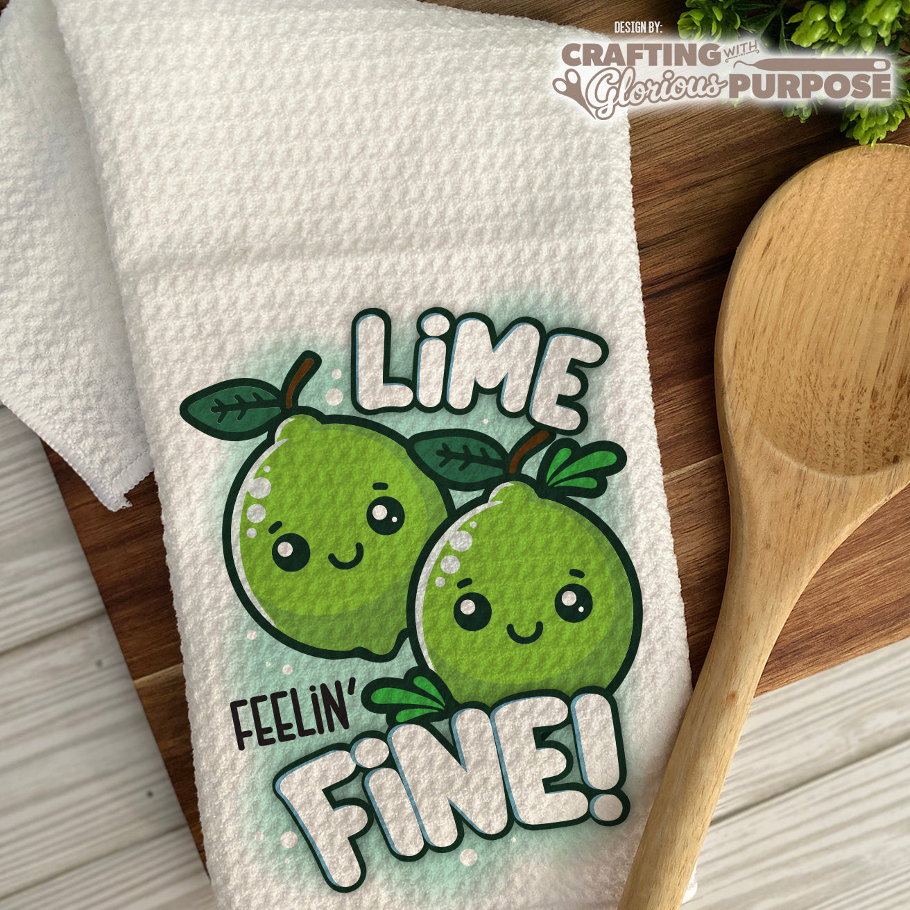Kawaii lime design on a towel with 'Lime Feelin' Fine!' text, wooden spoon on the side.