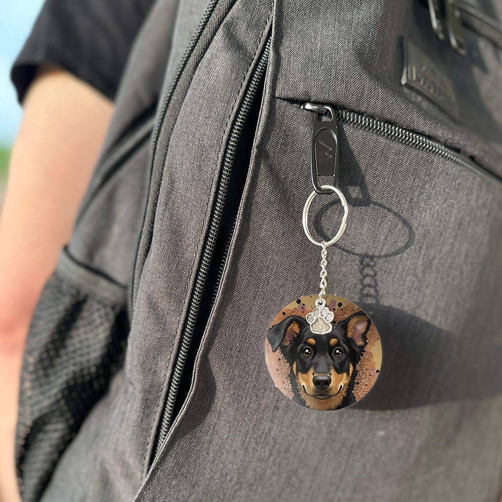 Keychain with a dog's face attached to a gray bag