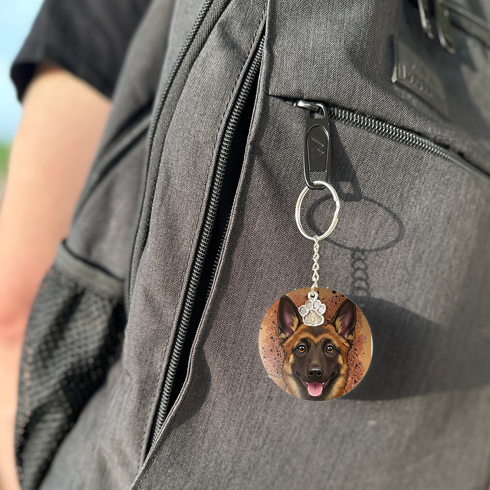 Keychain with a dog's face attached to a gray bag