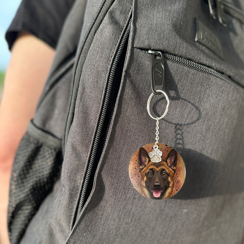 Keychain with a dog's face attached to a gray bag