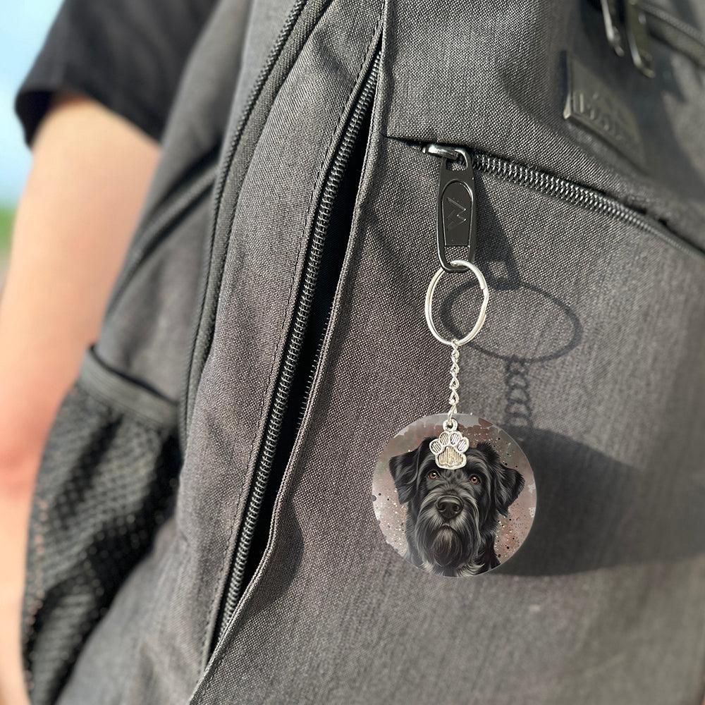 Keychain with a dog's face attached to a gray bag