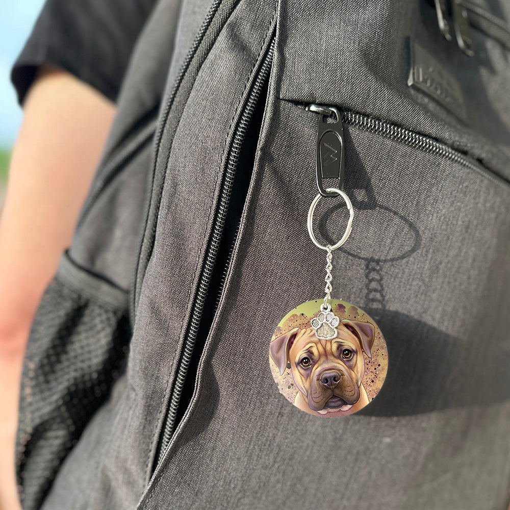 Keychain with a dog's face attached to a gray bag