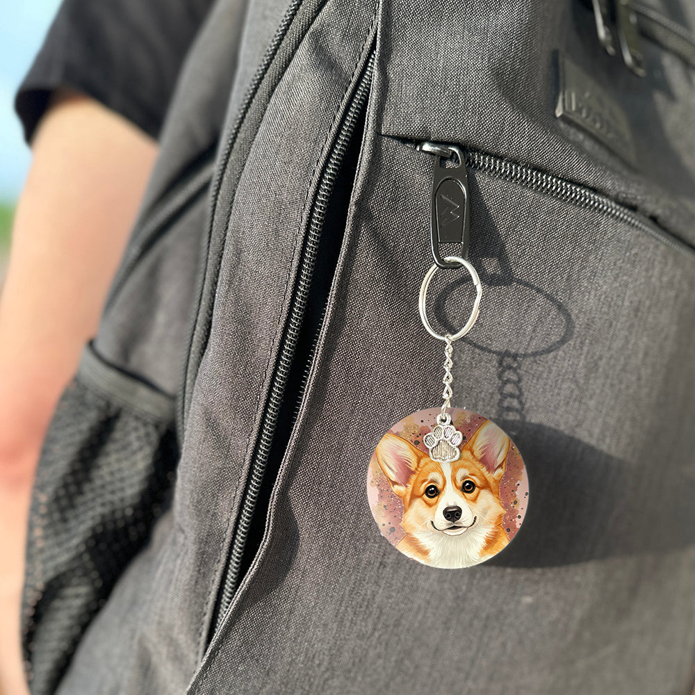 Keychain with a dog's face attached to a gray bag