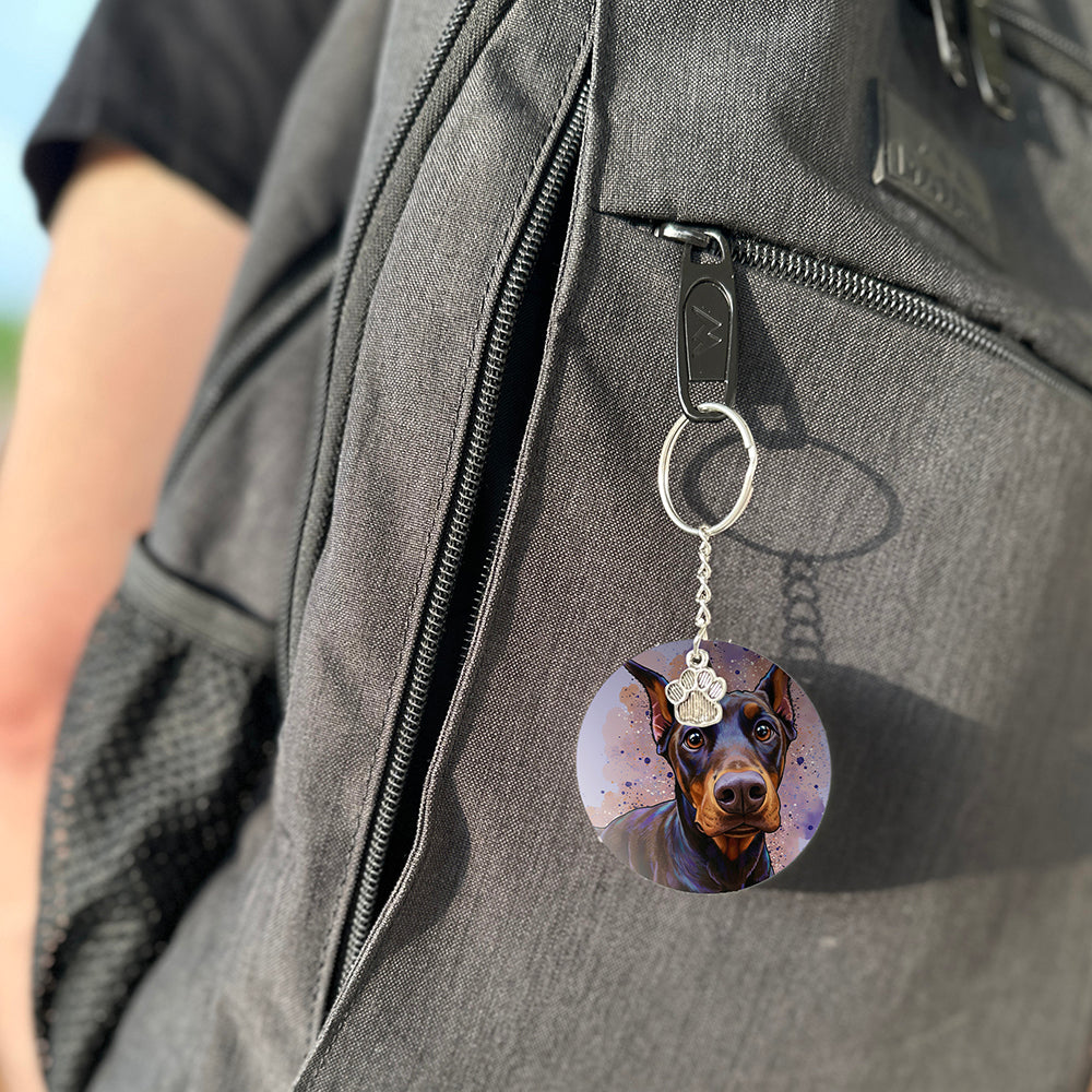 Keychain with a dog's face attached to a gray bag