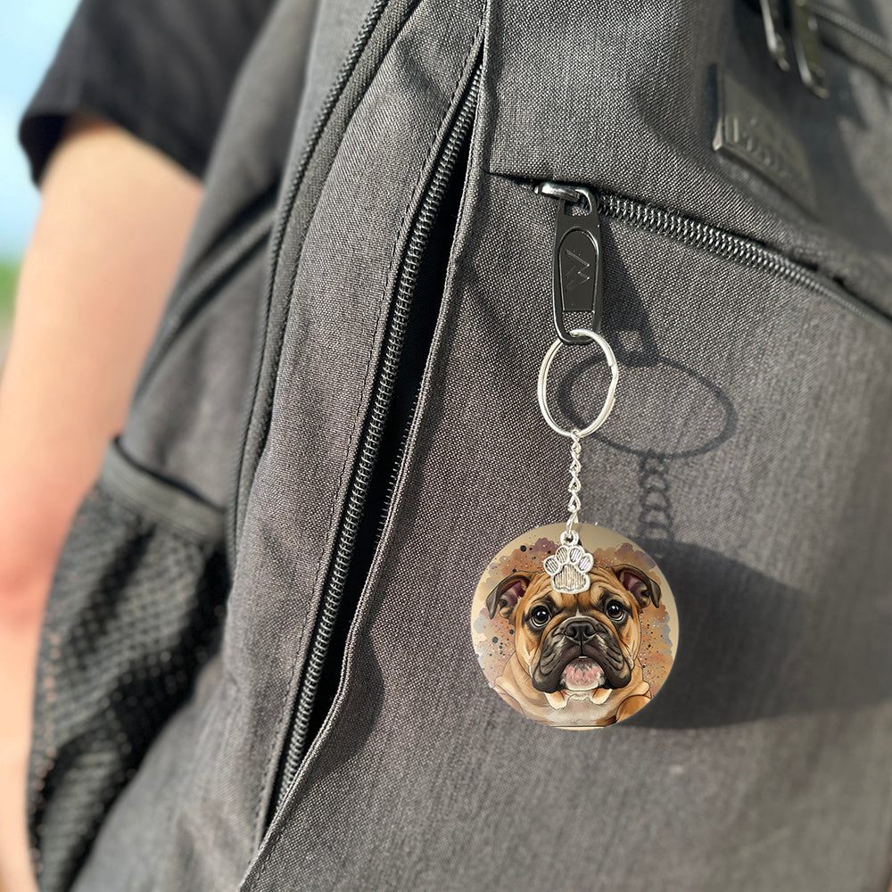 Keychain with a dog's face attached to a gray bag