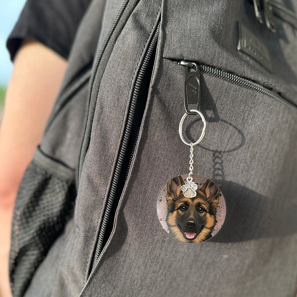Keychain with a dog's face attached to a gray bag