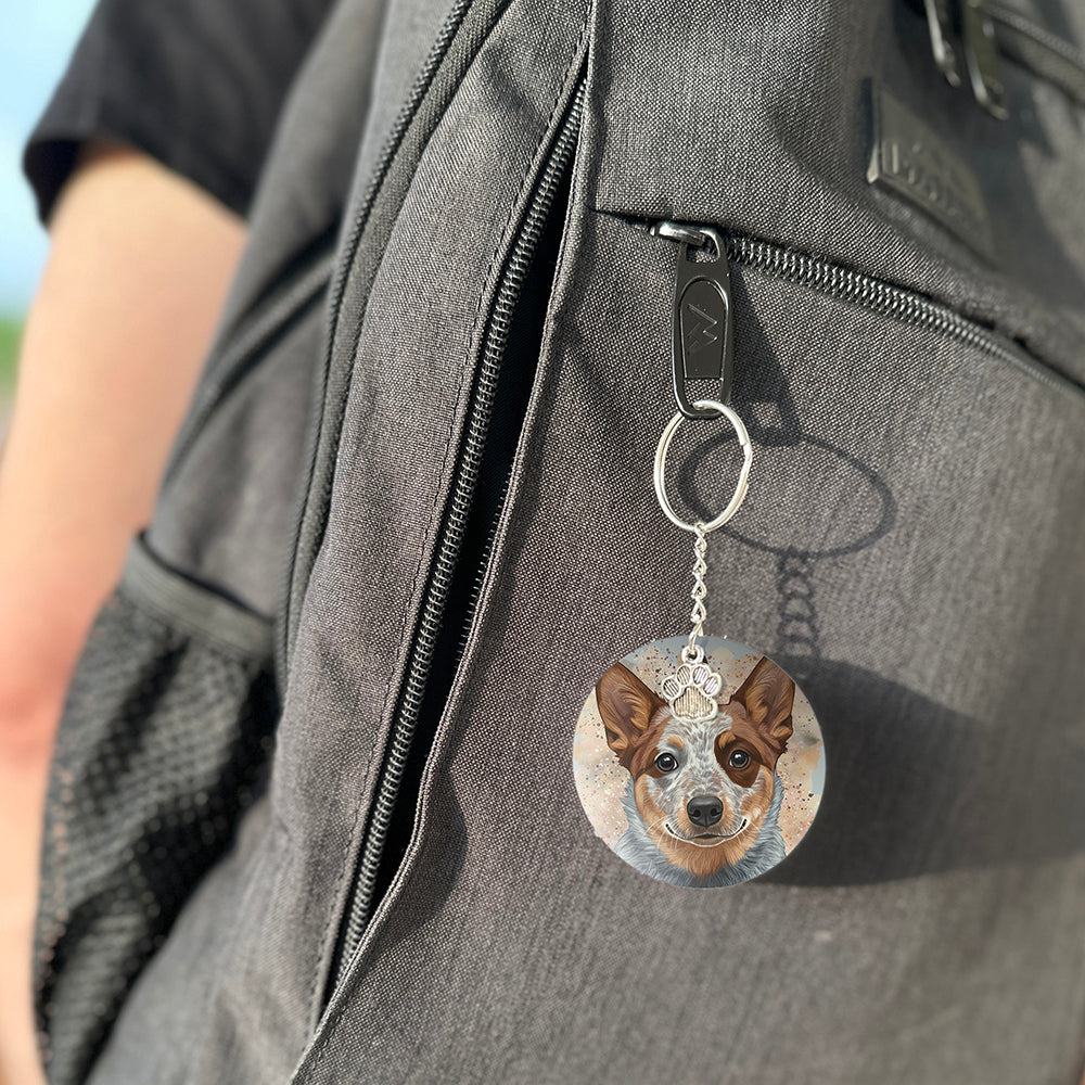 Keychain with a dog's face attached to a gray bag