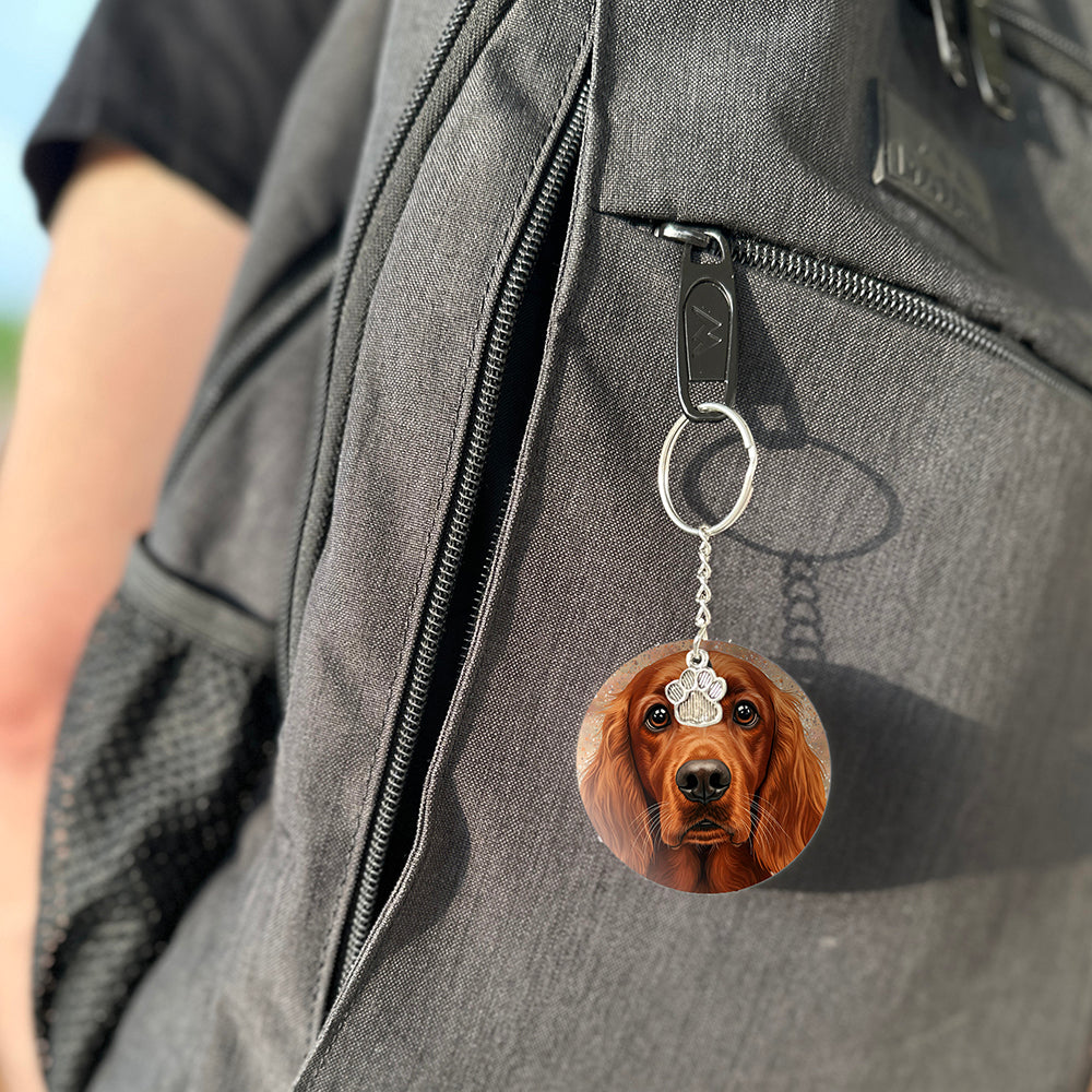 Keychain with a dog's face attached to a gray bag