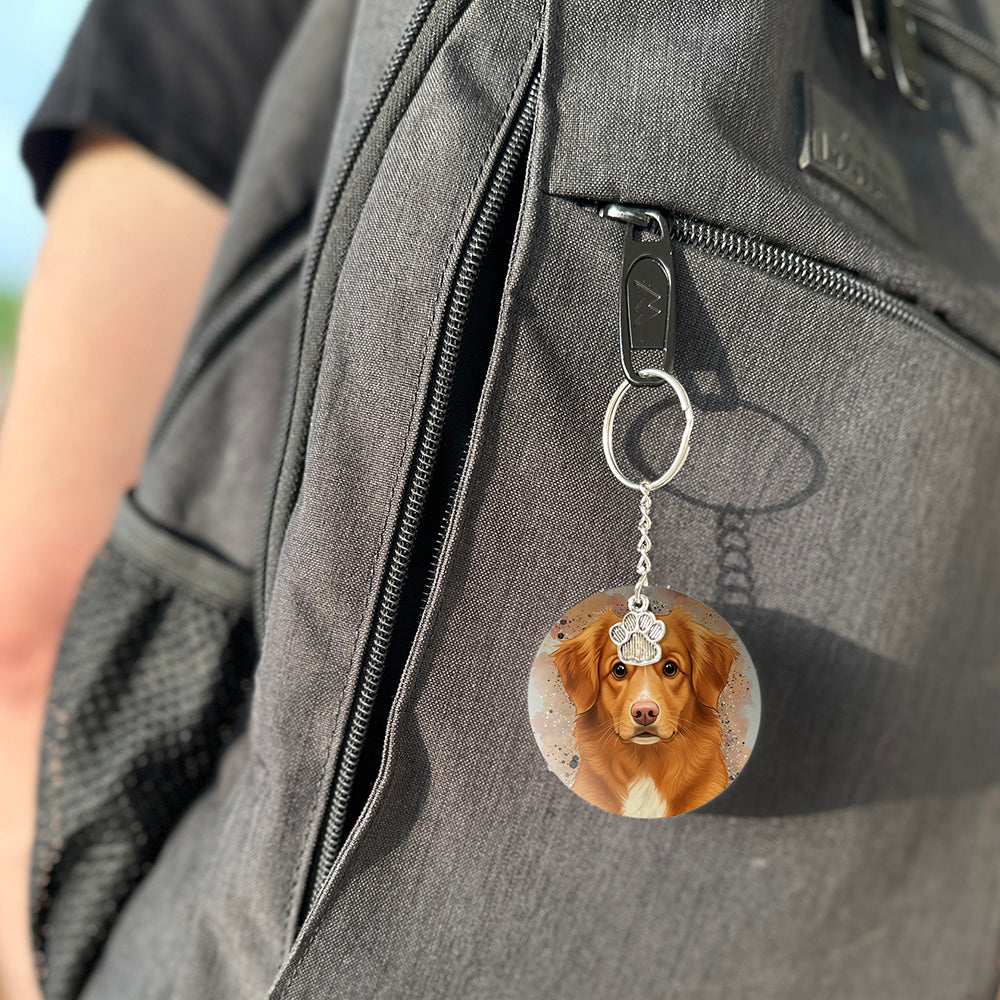 Keychain with a dog's face attached to a gray bag