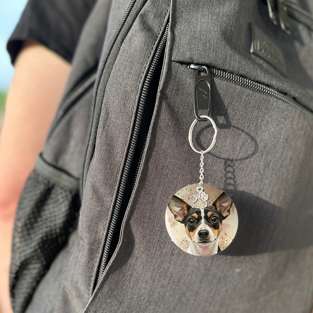 Keychain with a dog's face attached to a gray bag