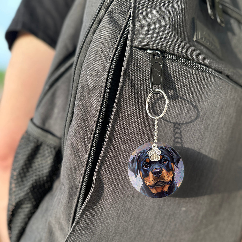 Keychain with a dog's face attached to a gray bag